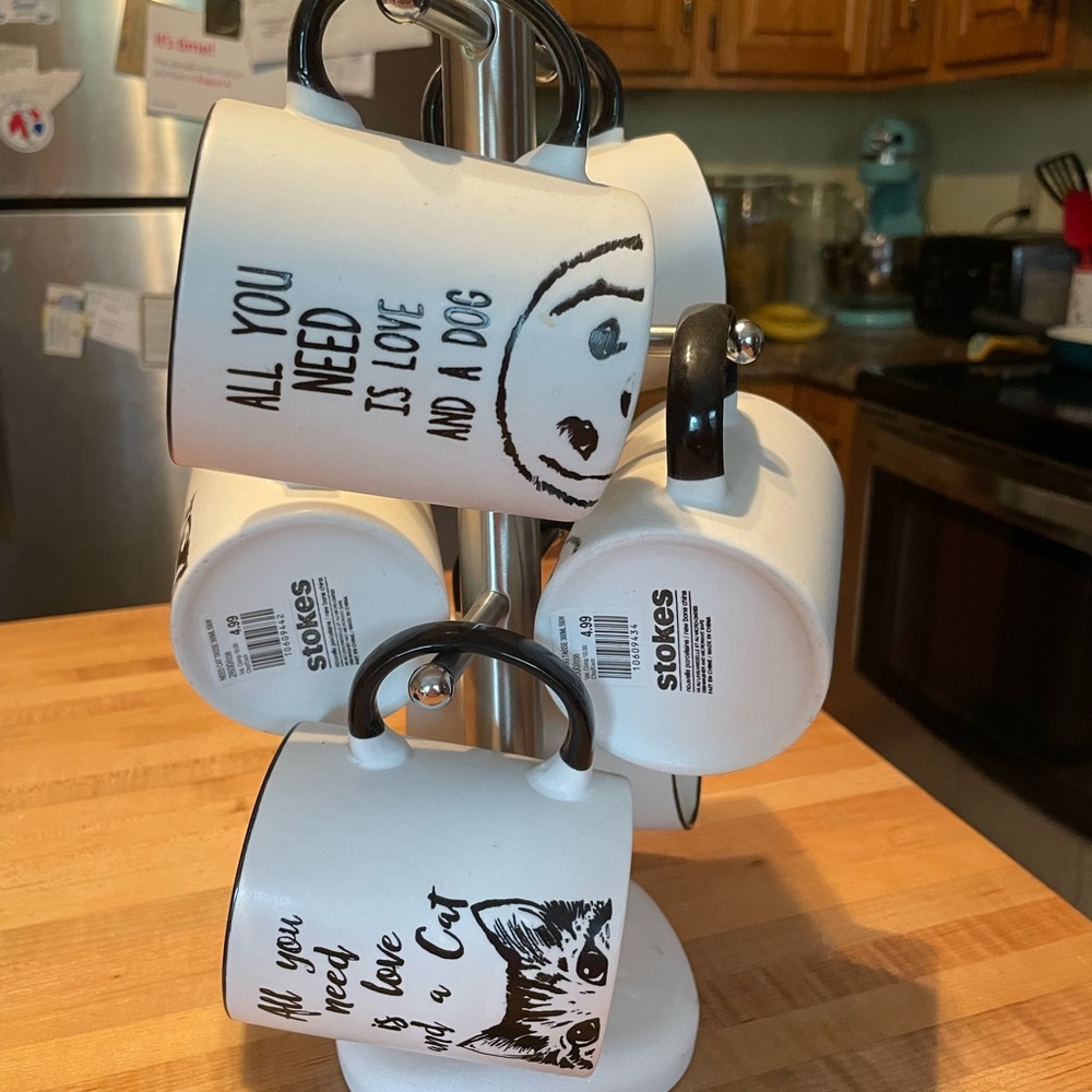 6 beautiful cat and dog coffee mugs from Stokes. All brand new with stand